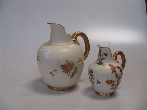 Lot 42 - Two Royal Worcester floral ewers