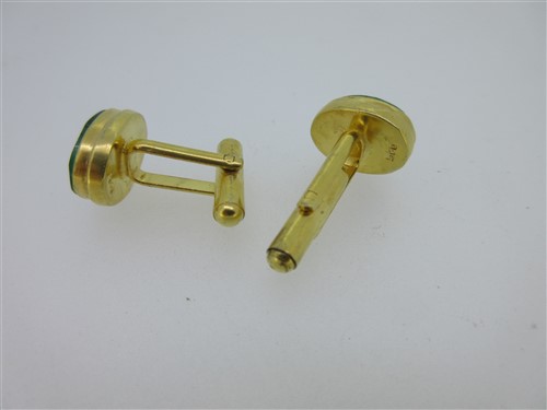 Lot 73 - A pair of single ended emerald cufflinks and a similar pair set with lapis lazuli