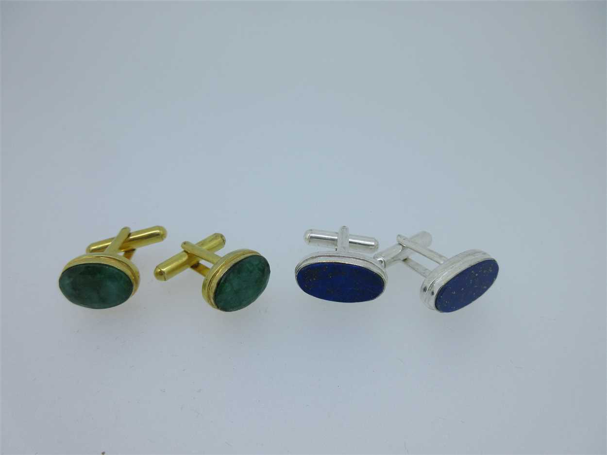 Lot 73 - A pair of single ended emerald cufflinks and a similar pair set with lapis lazuli