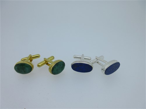Lot 73 - A pair of single ended emerald cufflinks and a similar pair set with lapis lazuli