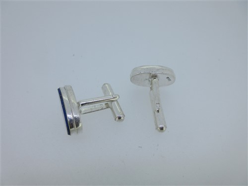 Lot 73 - A pair of single ended emerald cufflinks and a similar pair set with lapis lazuli