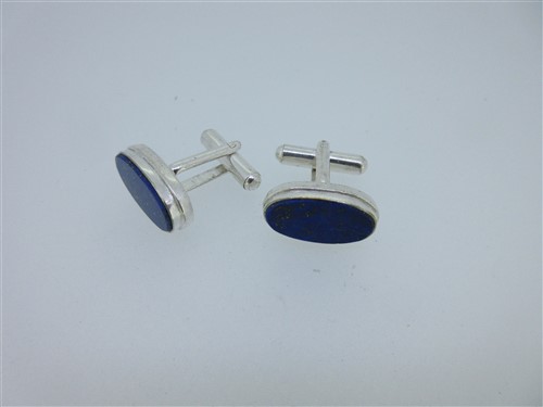 Lot 73 - A pair of single ended emerald cufflinks and a similar pair set with lapis lazuli