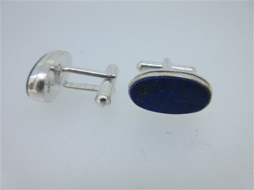 Lot 73 - A pair of single ended emerald cufflinks and a similar pair set with lapis lazuli