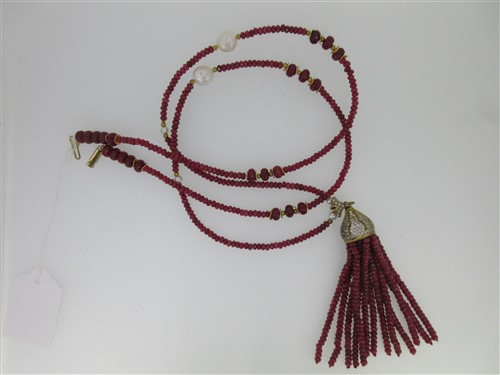 Lot 173 - A ruby bead necklace with tassel centrepiece