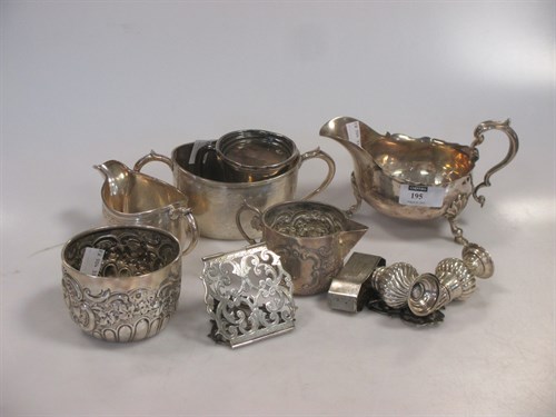 Lot 195 - Silver: a sauceboat (marks rubbed), two cream...
