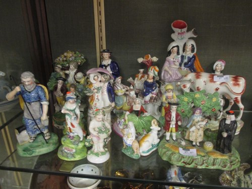Lot 27 - A group of 19th century Staffordshire figures...