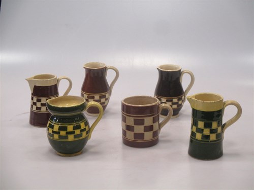 Lot 70 - A collection of 19th century pottery jugs to...