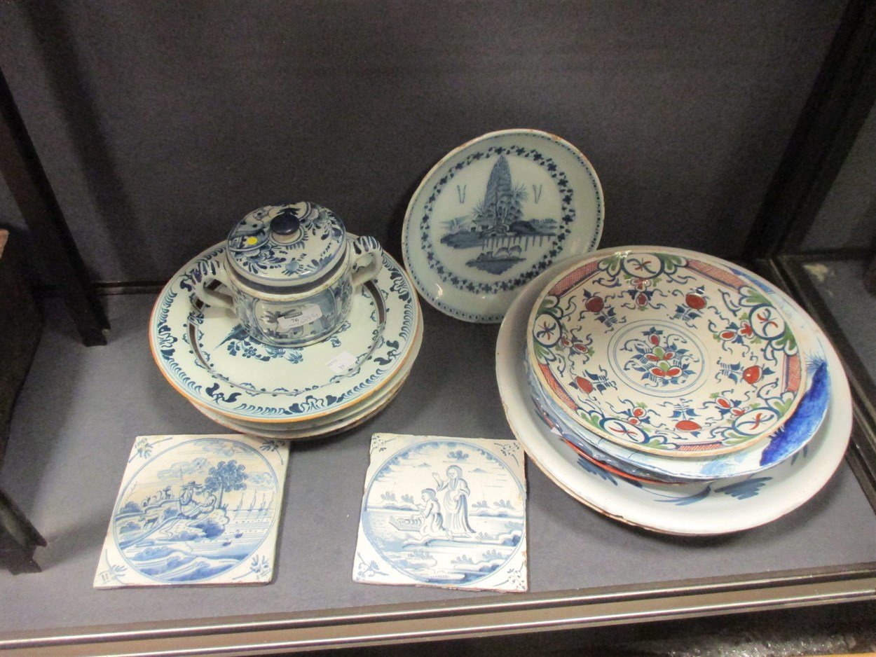 Lot 76 - A Delft polychrome plate, decorated to the...