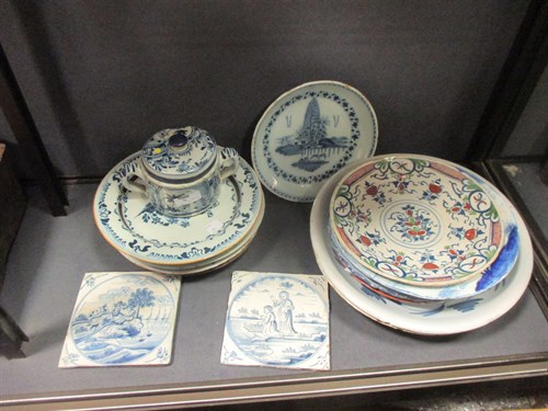 Lot 76 - A Delft polychrome plate, decorated to the...