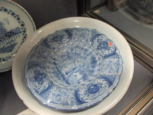 Lot 76 - A Delft polychrome plate, decorated to the...