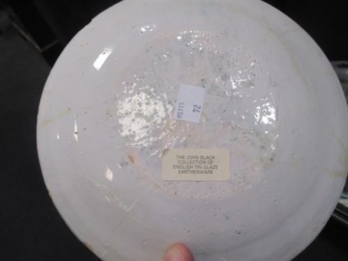 Lot 76 - A Delft polychrome plate, decorated to the...