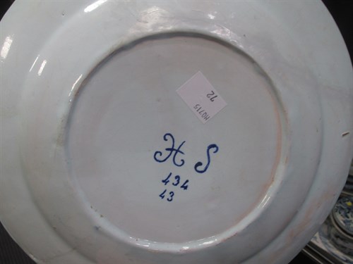 Lot 76 - A Delft polychrome plate, decorated to the...