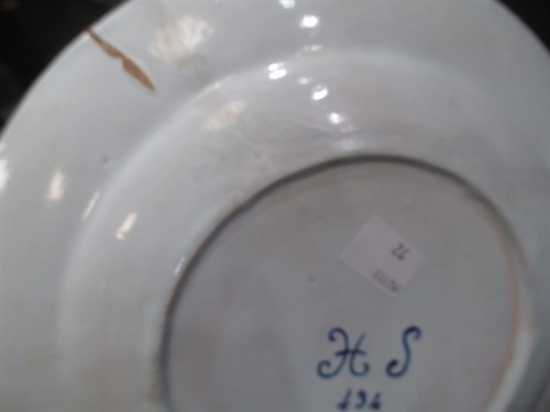 Lot 76 - A Delft polychrome plate, decorated to the...
