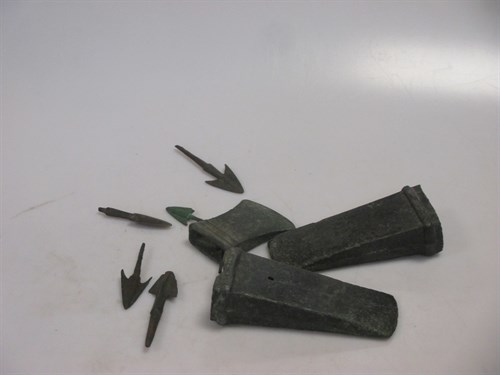 Lot 124 - Collection of bronze age axe heads and arrows