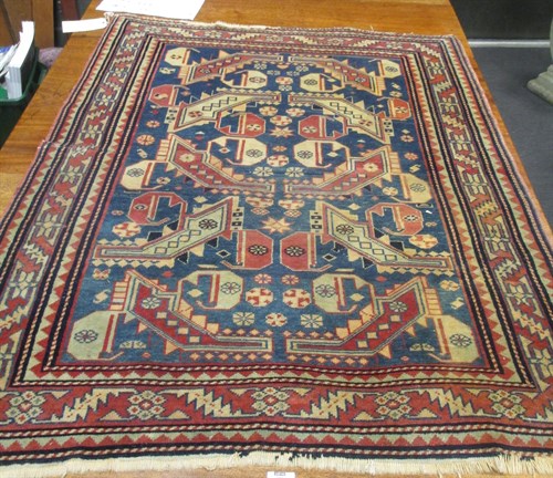 Lot 472 - A Causasian Wool Rug. 130x100 cm