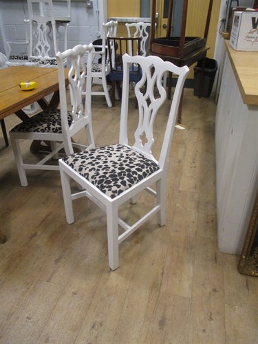 Lot 381 - A set of eight white painted chippendale style...