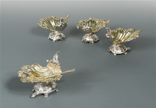 Lot 570 - A set of four George III silver standing salts with spoons