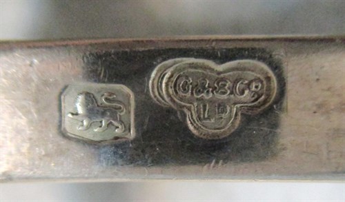 Lot 658 - A pair of George V silver asparagus tongs