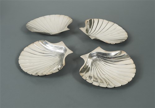 Lot 553 - A set of four George I scallop shell dishes