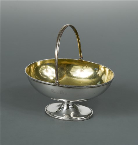Lot 621 - A Victorian silver swing handled sugar basket by Robert Garrard II