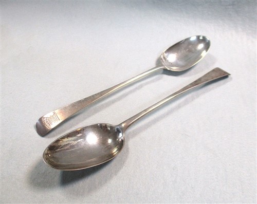 Lot 555 - A pair of George II silver basting spoons
