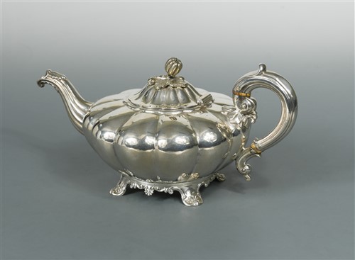 Lot 599 - A William IV silver melon shaped teapot