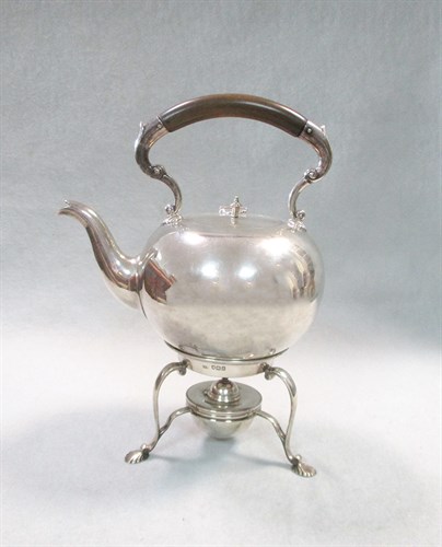 Lot 258 - A George V silver bullet shaped tea kettle and stand
