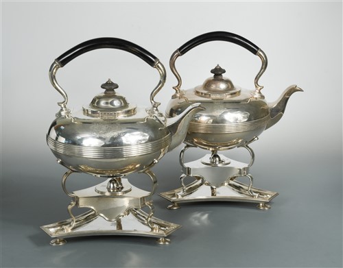 Lot 624 - A pair of late 19th / early 20th century silver tea kettles and stands by Garrard & Co