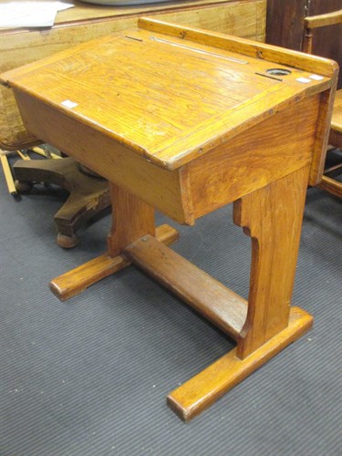 Lot 343 - An oak childs desk
