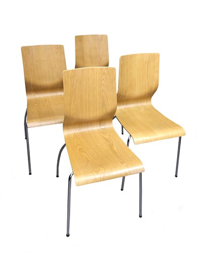 Lot 321 - A set of eight oak laminate bent plywood stacking chairs