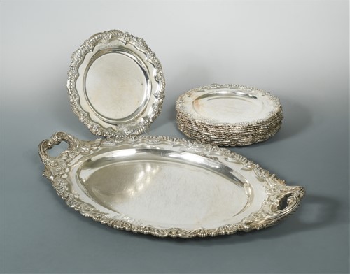 Lot 597 - A set of twelve George IV silver dinner plates with accompanying two handled tray