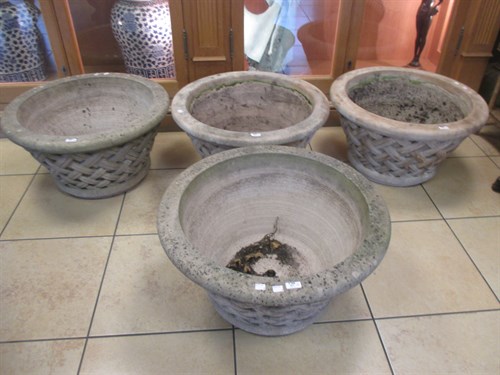 Lot 454 - A pair of reconstituted garden urns with...