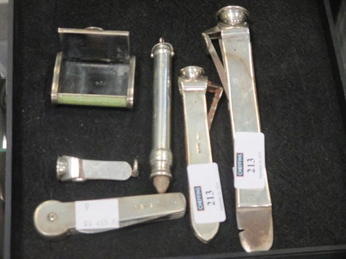 Lot 213 - Three silver cigar cutters, a silver penknife,...
