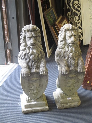 Lot 459 - A pair of reconstituted stone Heraldic lions (2)