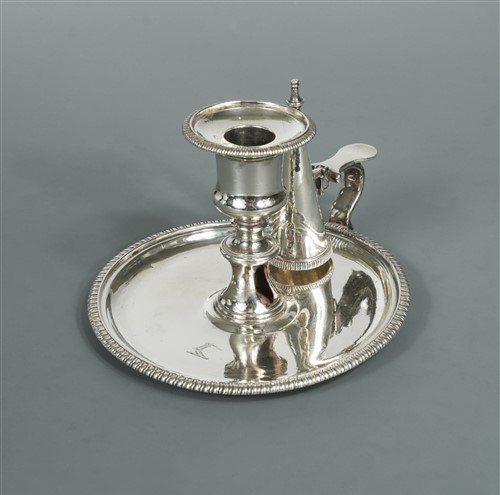 Lot 578 - A George III silver chamberstick and snuffer