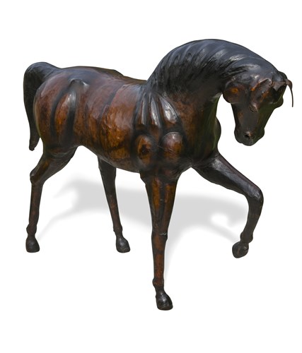 Lot 311 - A large leather clad model of a horse