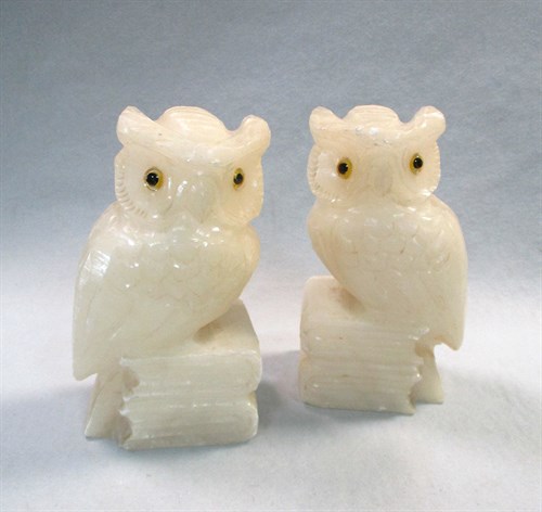 Lot 196 - A pair of carved alabaster bookends