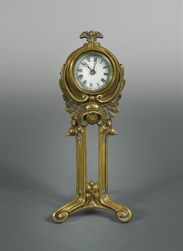 Lot 202 - An Art Nouveau brass desk clock by the British United Clock Co.