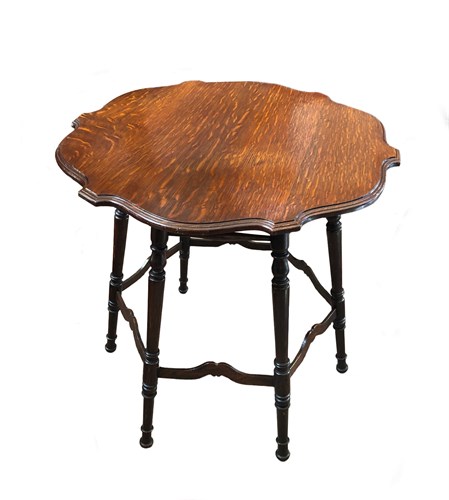 Lot 241 - In the manner of Morris & Co., an Arts & Crafts oak occasional table