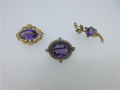 Lot 181 - A trio of antique amethyst and seed pearl  brooches