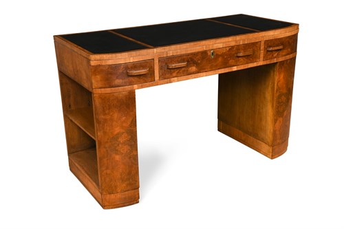Lot 284 - An Art Deco leather inset walnut writing table