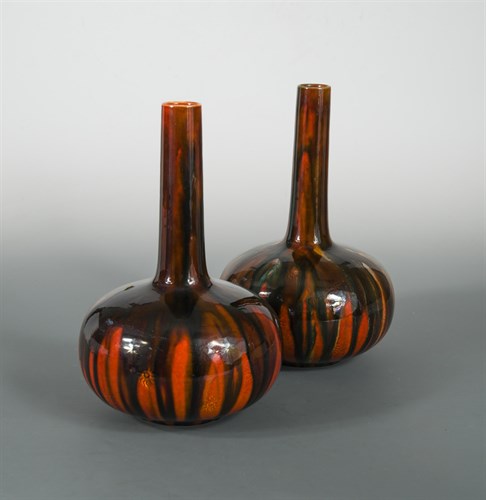 Lot 21 - A pair of Burmantofts bottle vases, possibly designed by Dr Christopher Dresser