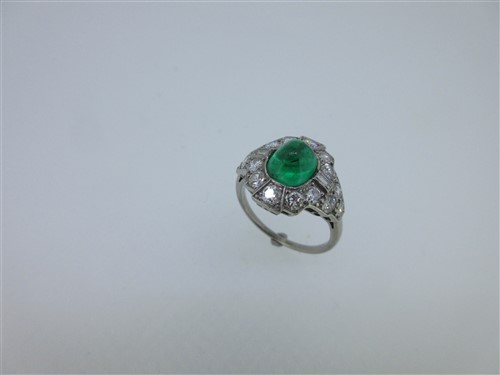 Lot 311 - An emerald and diamond cluster ring