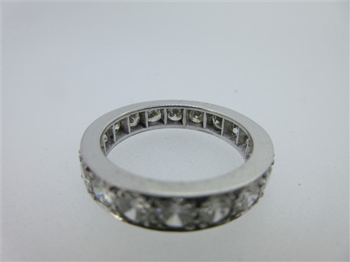 Lot 217 - A diamond full hoop eternity ring