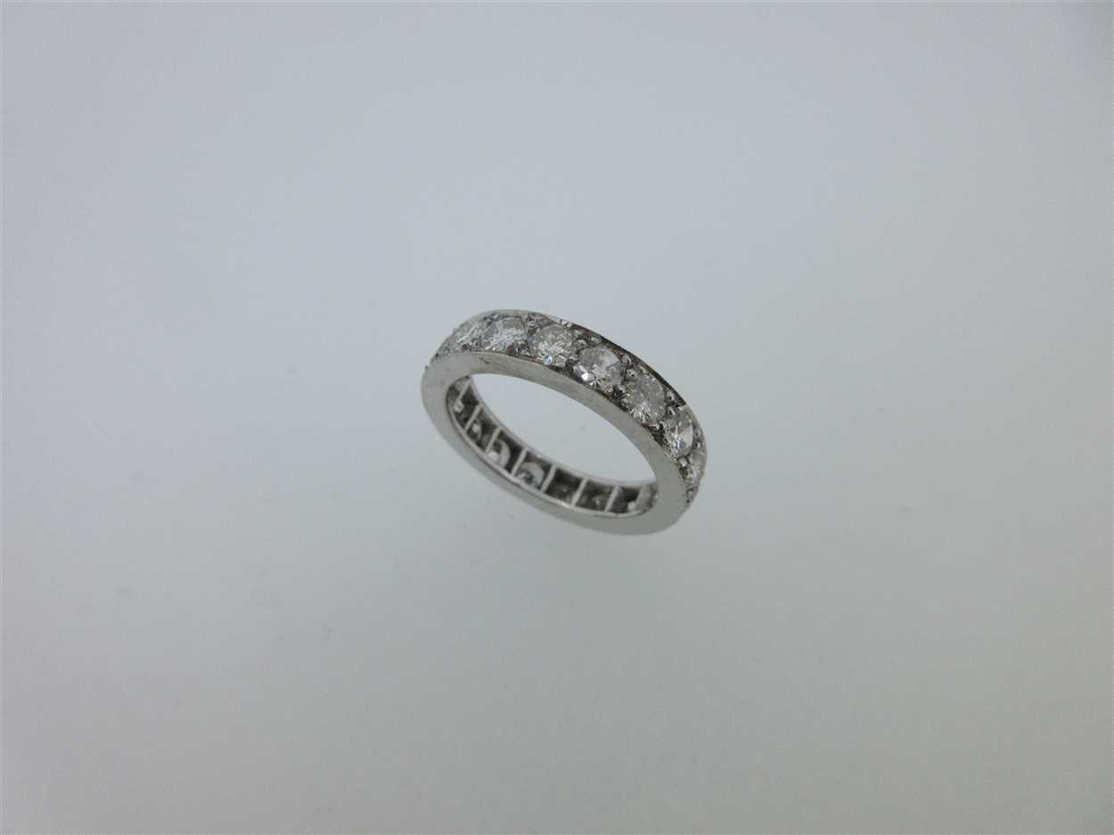 Lot 217 - A diamond full hoop eternity ring