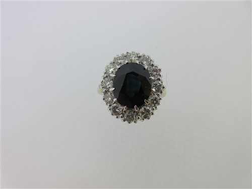 Lot 160 - A sapphire and diamond cluster ring