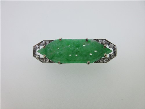 Lot 75 - An Art Deco carved jade plaque and diamond brooch