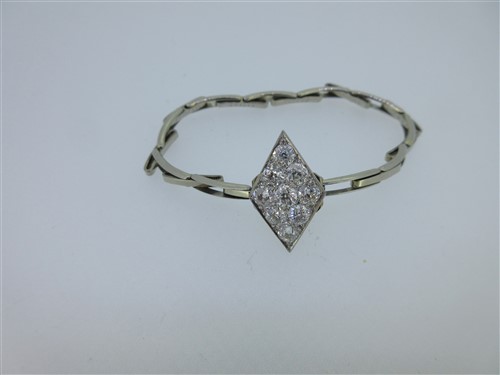 Lot 259 - A diaper form diamond plaque set into an expanding bracelet