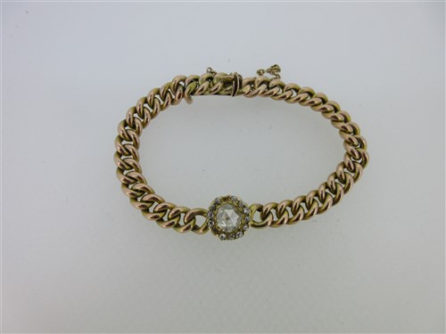 Lot 238 - A curb link bracelet with diamond cluster centrepiece
