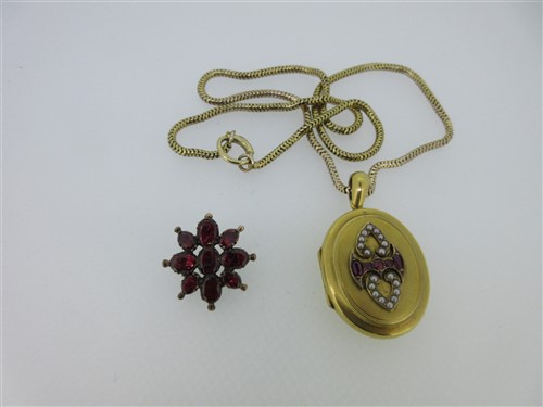Lot 297 - A Victorian ruby and seed pearl set locket on chain together with a Georgian garnet brooch
